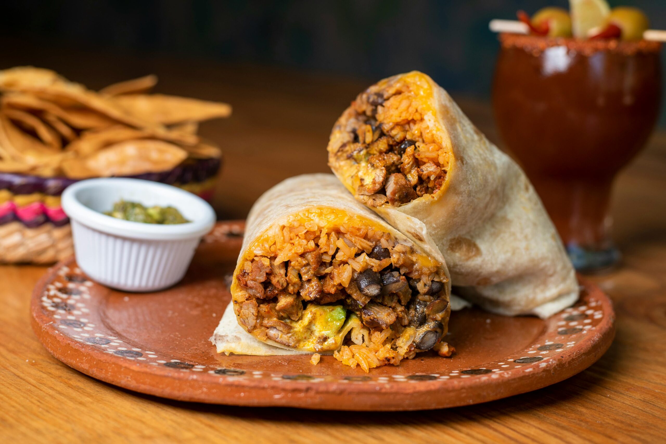Close-up of a Mexican burrito filled with rice and beans, perfect for food lovers.